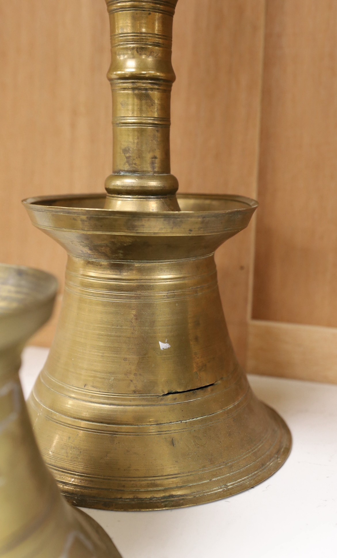 Two Ottoman brass candlesticks, height 28cm